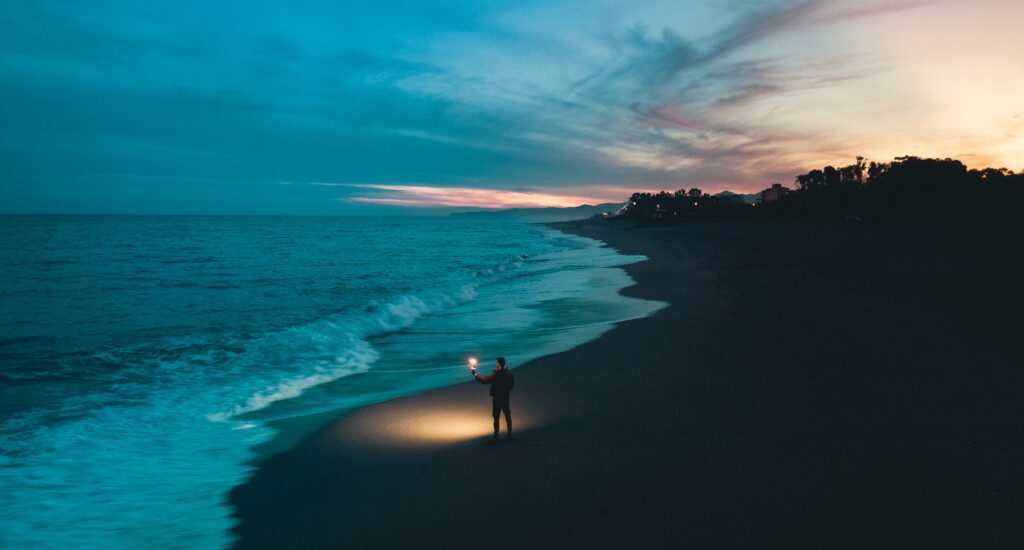 A man surfing on a ocean wave